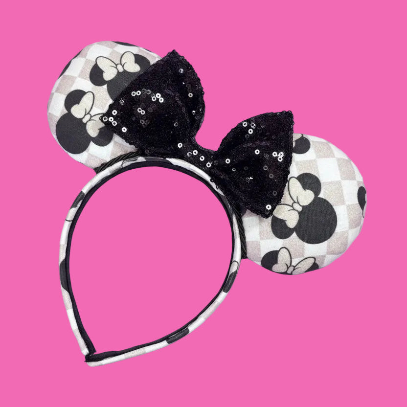 Handmade and ready to ship Checkered Mouse ears with famous Minnie ear bows on the design and a black sequin bow with black twisted trim on a universal sized headband.