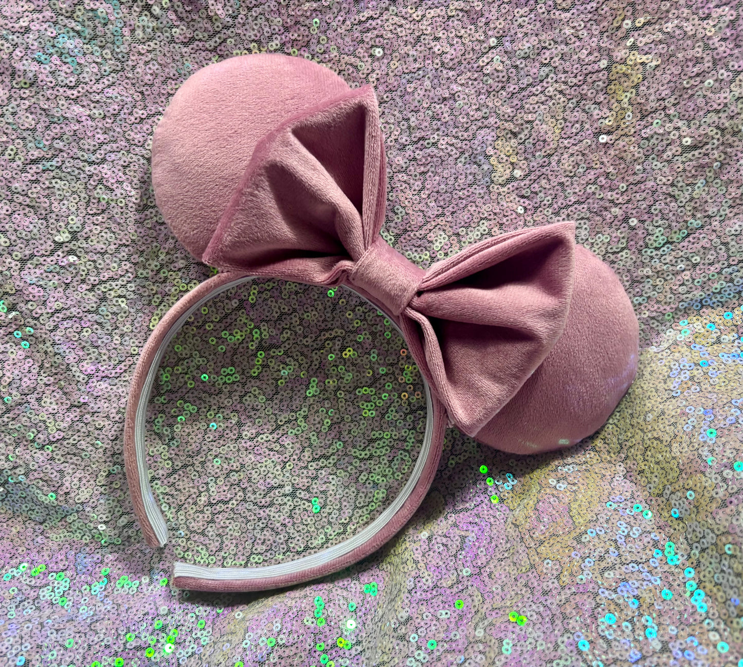 Handmade and ready to ship. Soft Velvety dusty pink Mouse ears with a soft matching bow with pink twisted trim on a universal sized matching headband.