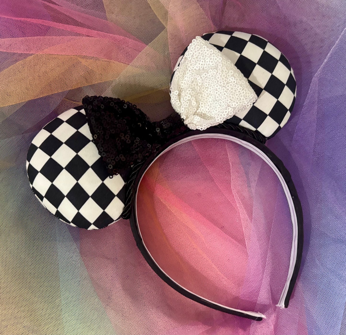 Black and white checkered mouse ears with a rainbow background. Made and ready to ship.