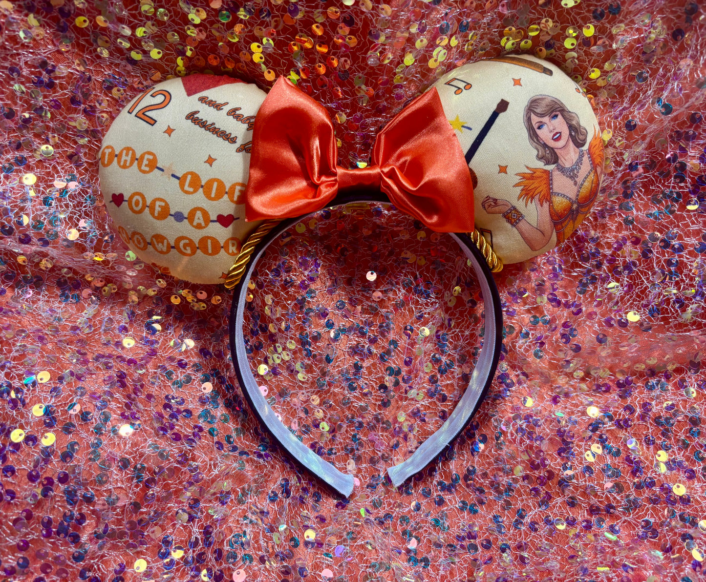 Handmade and ready to ship Ophelia Mouse ears with TS images on the ears along with TLOAS with an orange satin bow, orange twisted trim and on a black universal sized headband.