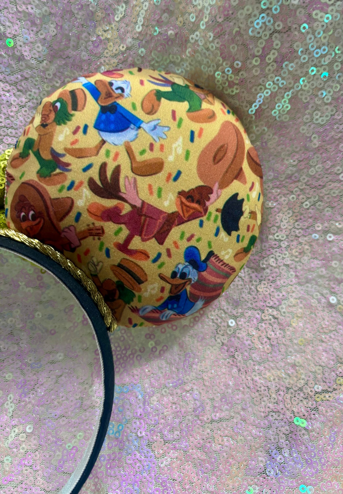 Handmade and ready to ship. These are perfect for Epcot. Three Caballero themed with a lime green sequin bow on a headband making mouse ears. Shown on a white background. Back right mouse ear is shown.