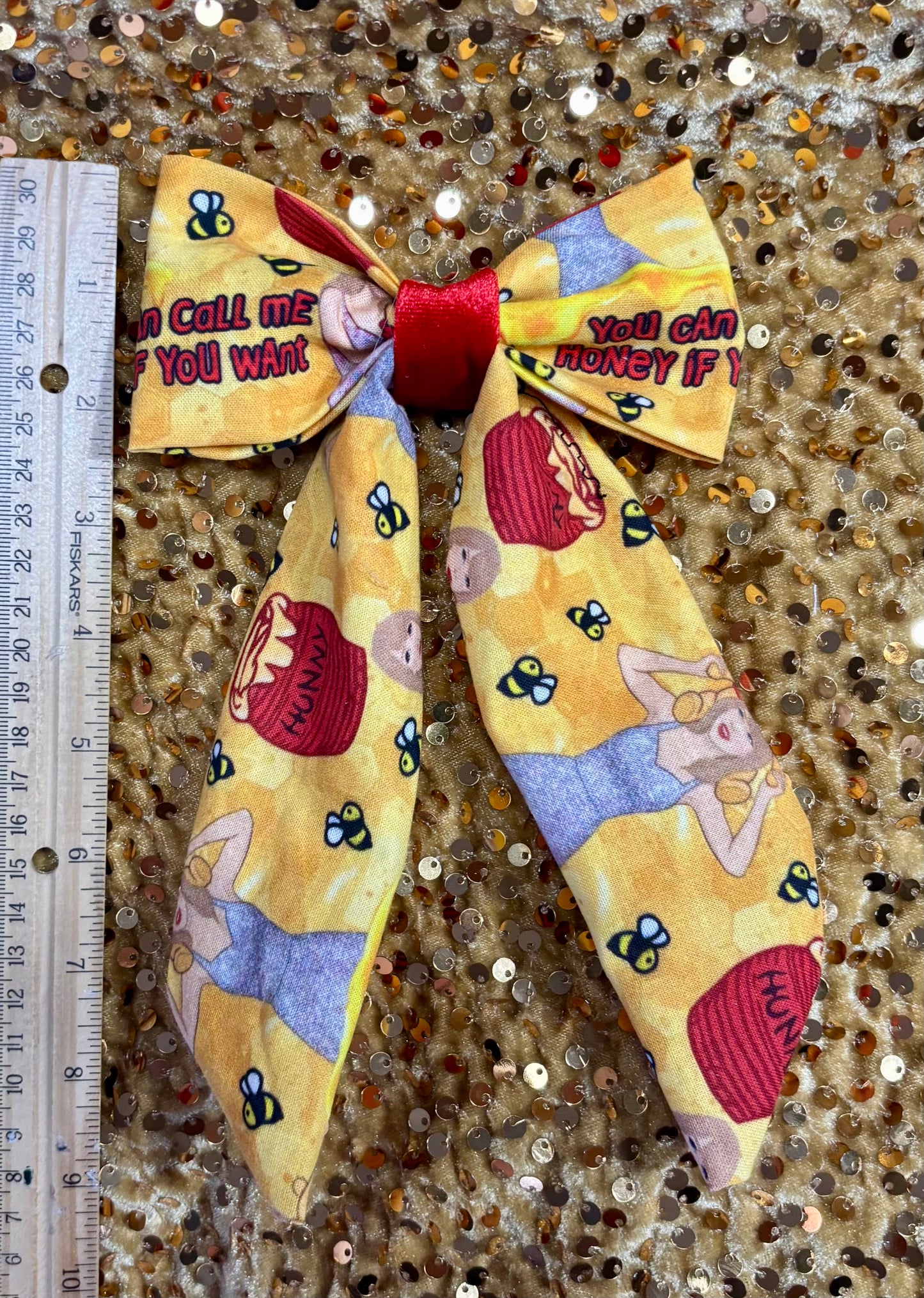 The You Can Call Me Hairbow next to a ruler for size reference.