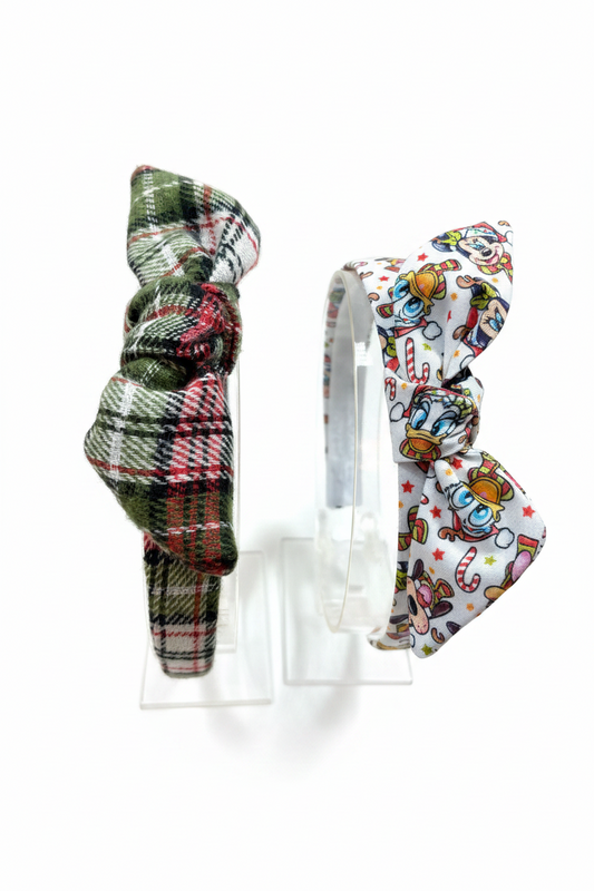 Two headbands, one plaid and one with a Christmas Pals pattern, on a white background. Handmade and ready to ship.