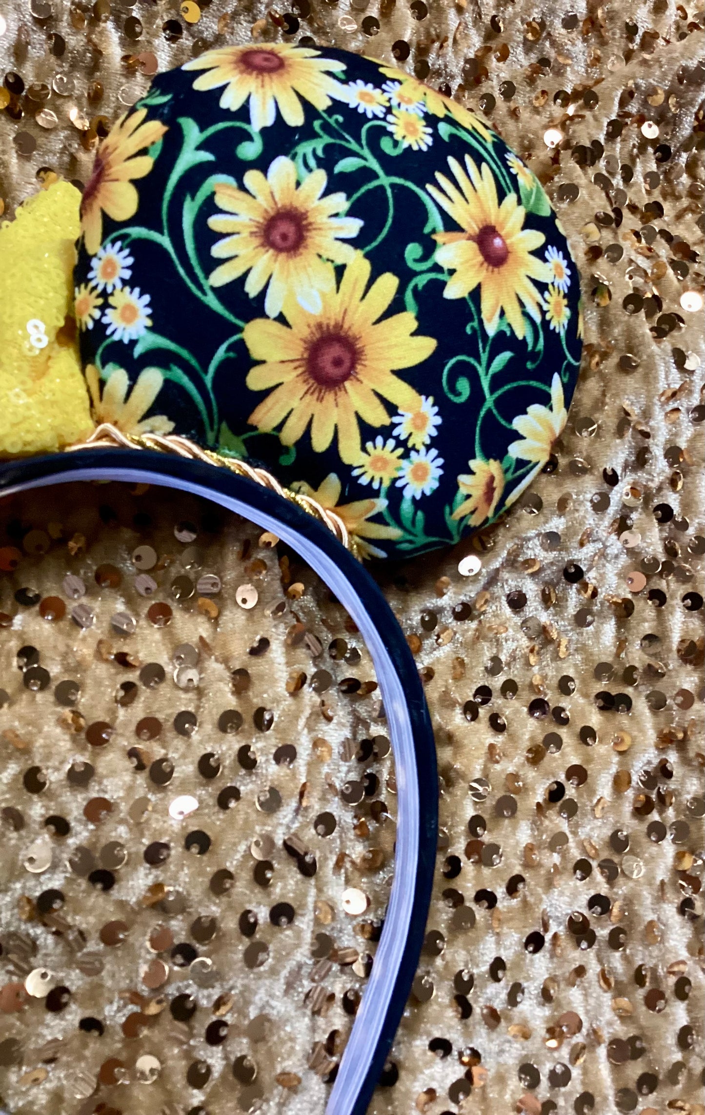 Floral headband with yellow flowers on a glittery background