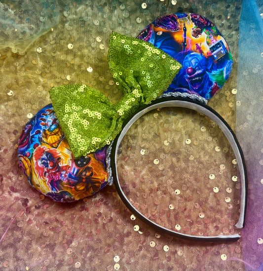 Colorful cult classic movie mouse ears with a green bow on a glittery background