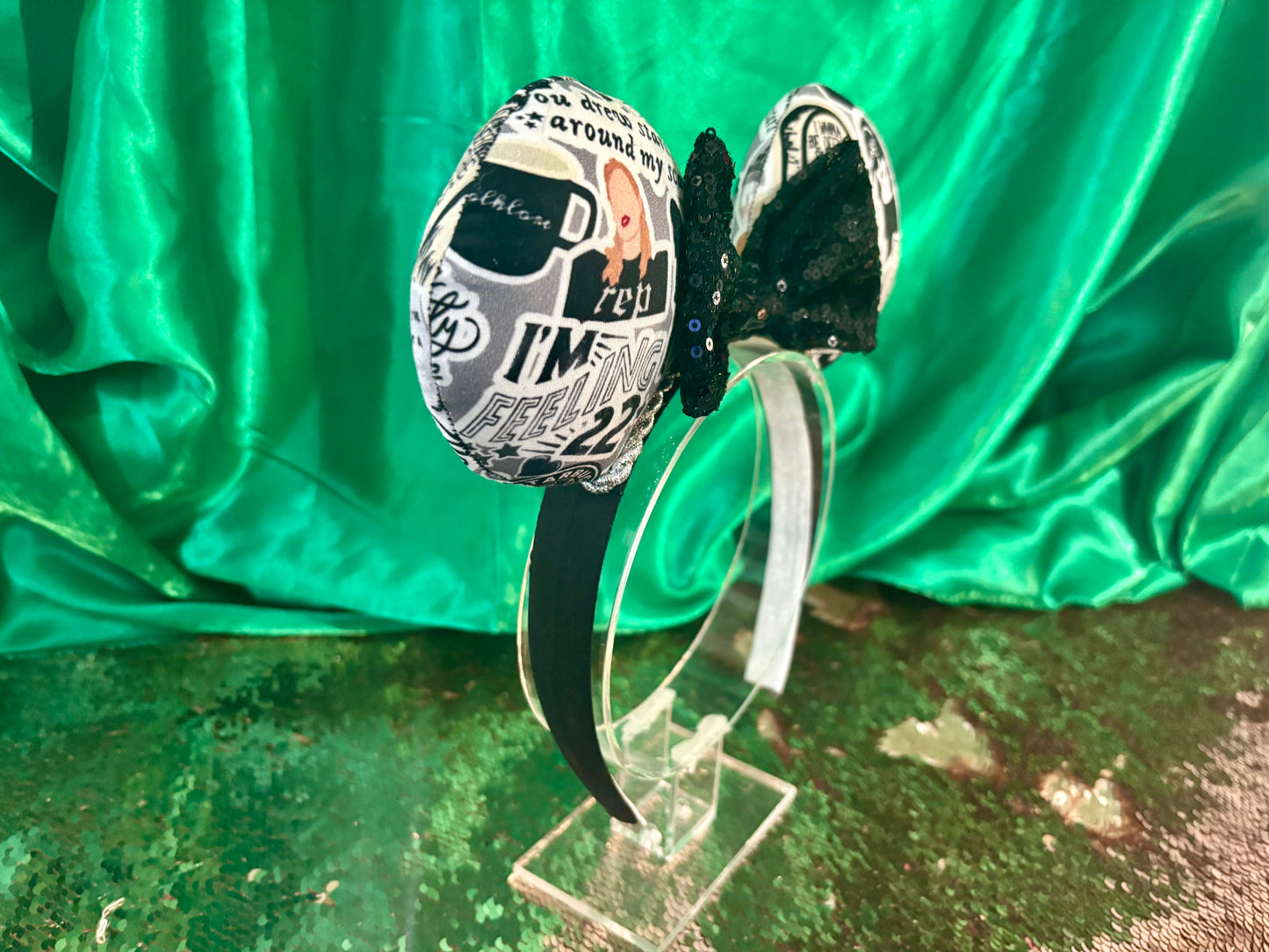 Handmade and ready to ship Mouse Ears with Black and White Swiftie sayings and pictures. has a black sequin bow.