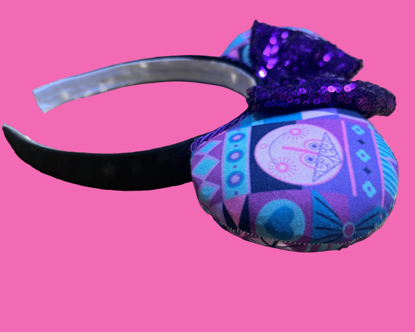 Handmade and ready to ship. Small world inspired Mouse ears. The fabric is on the fabric front and back with purple twisted trim and a purple sequin bow on a universal sized black headband.