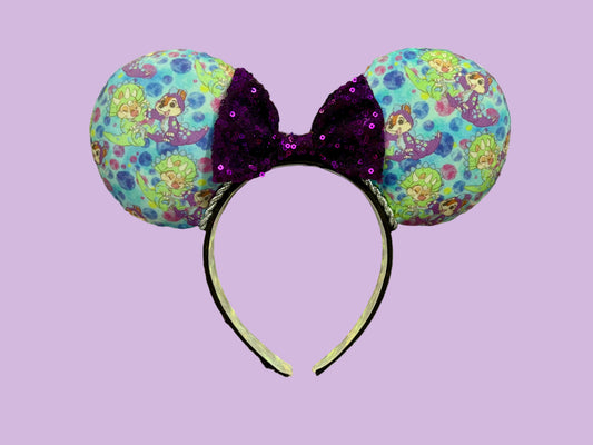 Handmade and ready to ship. Images of Dino Chipmunks on a blue fabric in their costumes from the old AK days on the front and back. These are handmade and ready to ship mouse ears with a purple sequin bow. On a universal sized headband. 