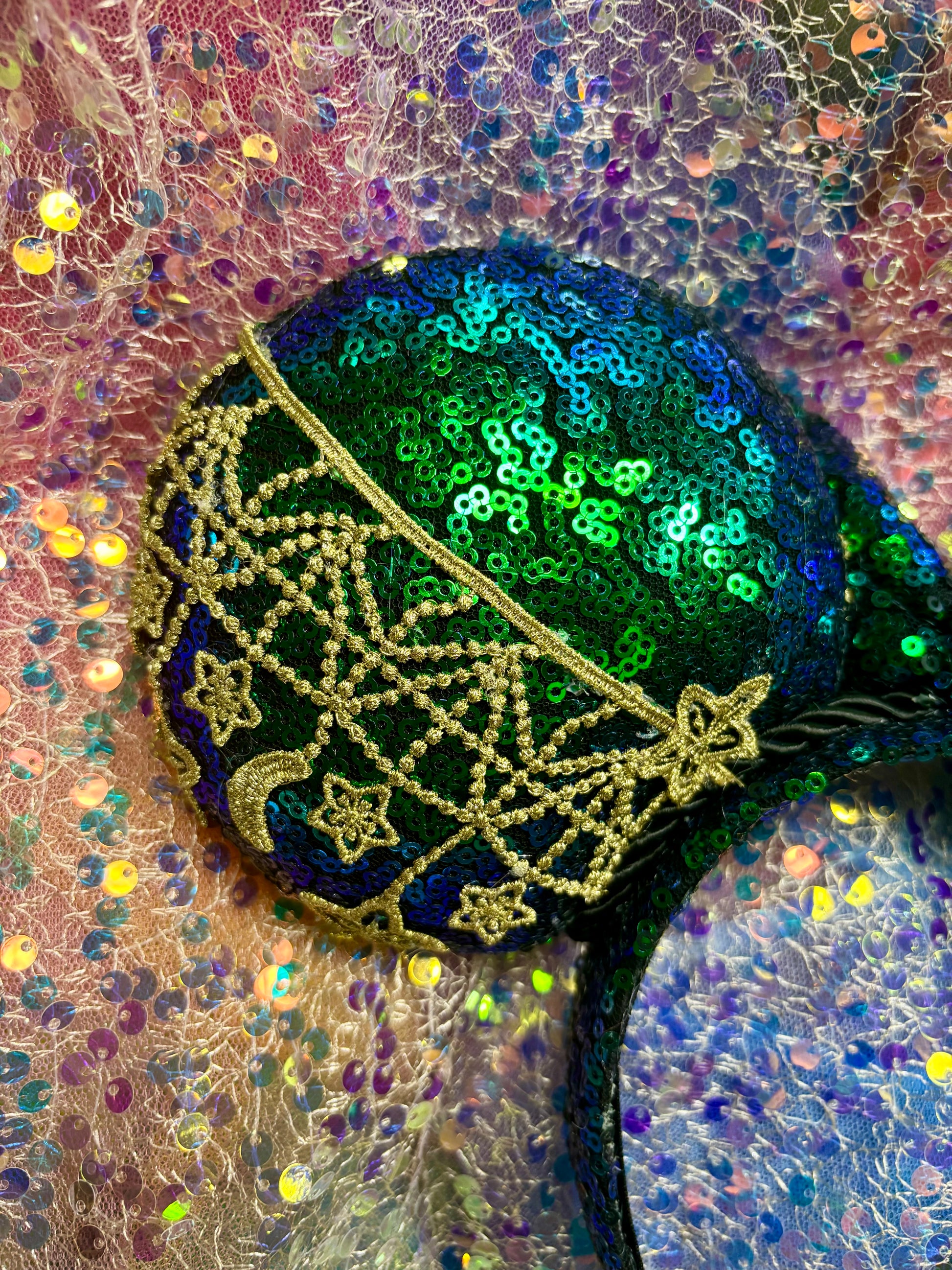  mouse ear close up with intricate gold patterns on a textured background