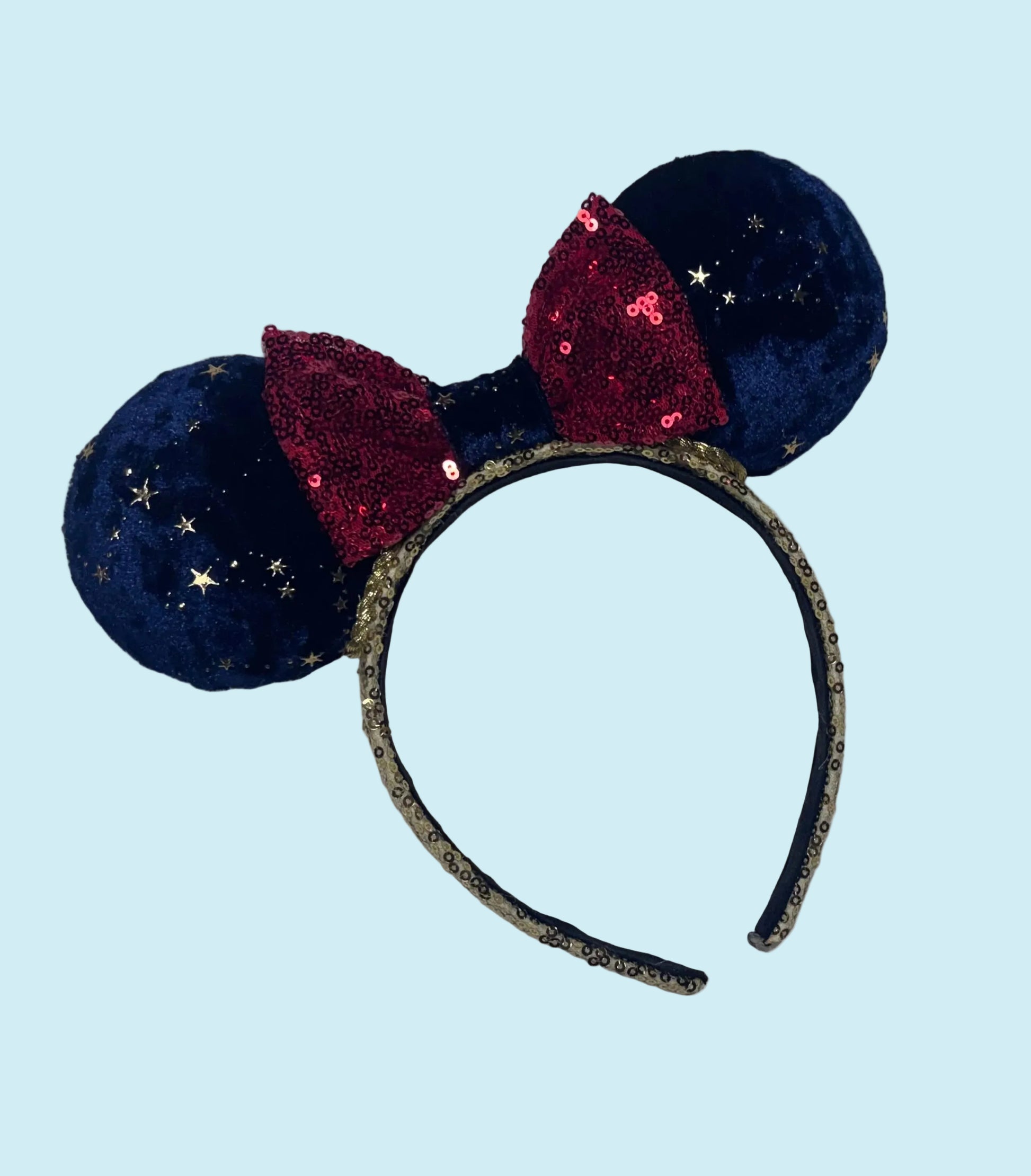 Handmade and ready to ship Navy Velvet fabric with gold stars and red sequin bow mouse ear headband on a gold sequin universal sized headband. 