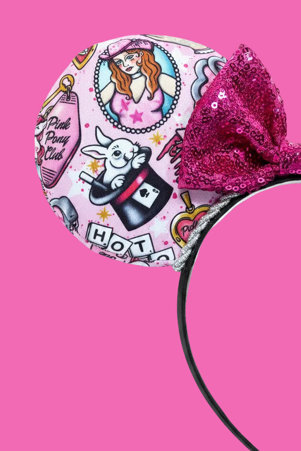 Pink themed headband with cartoon characters and images from the Midwest princess. 