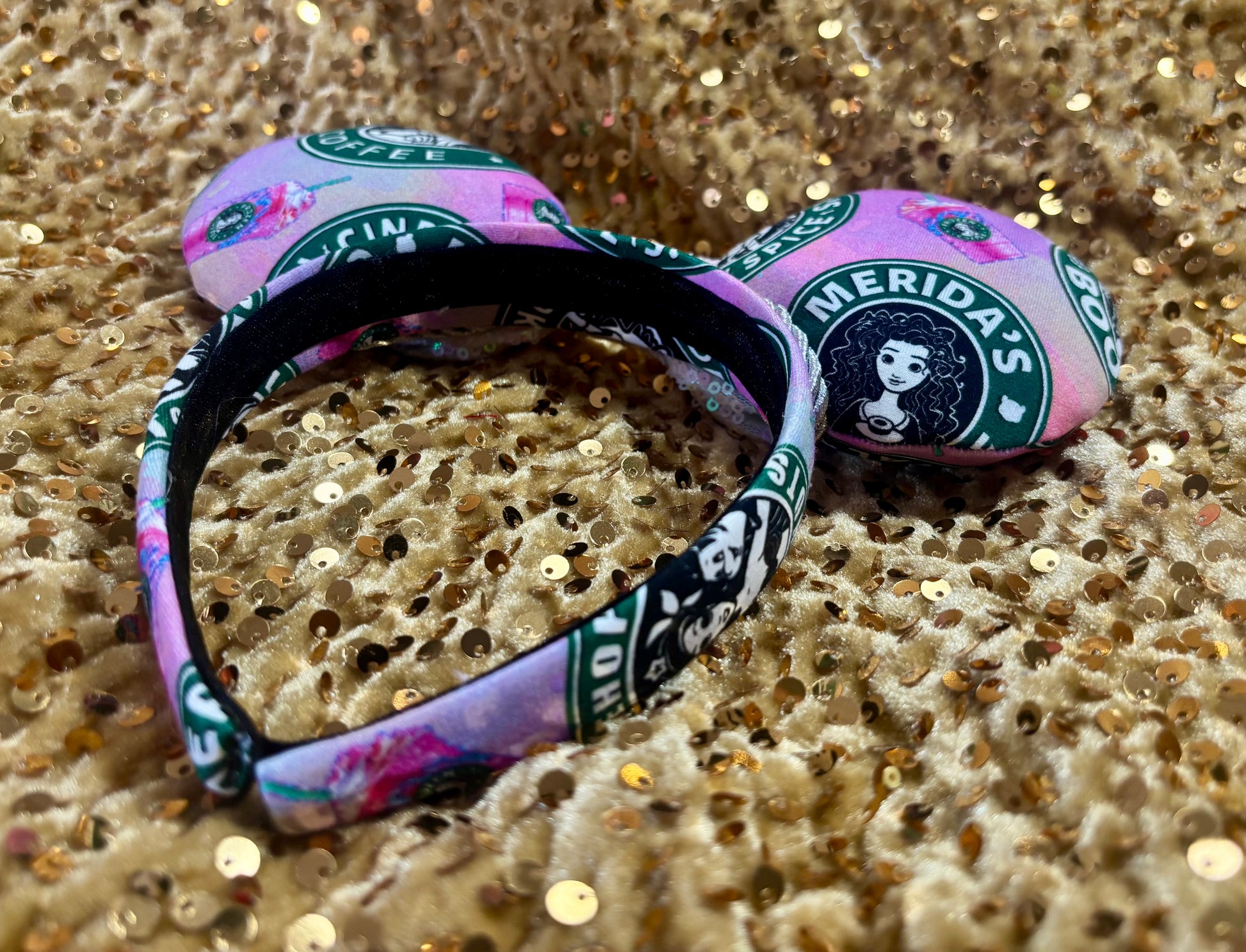 Handmade and ready to ship custom ears with popular coffee themed with princesses on fabric. White iridescent bow and silver twisted trim on a universal sized headband with matching design as the mouse ears.