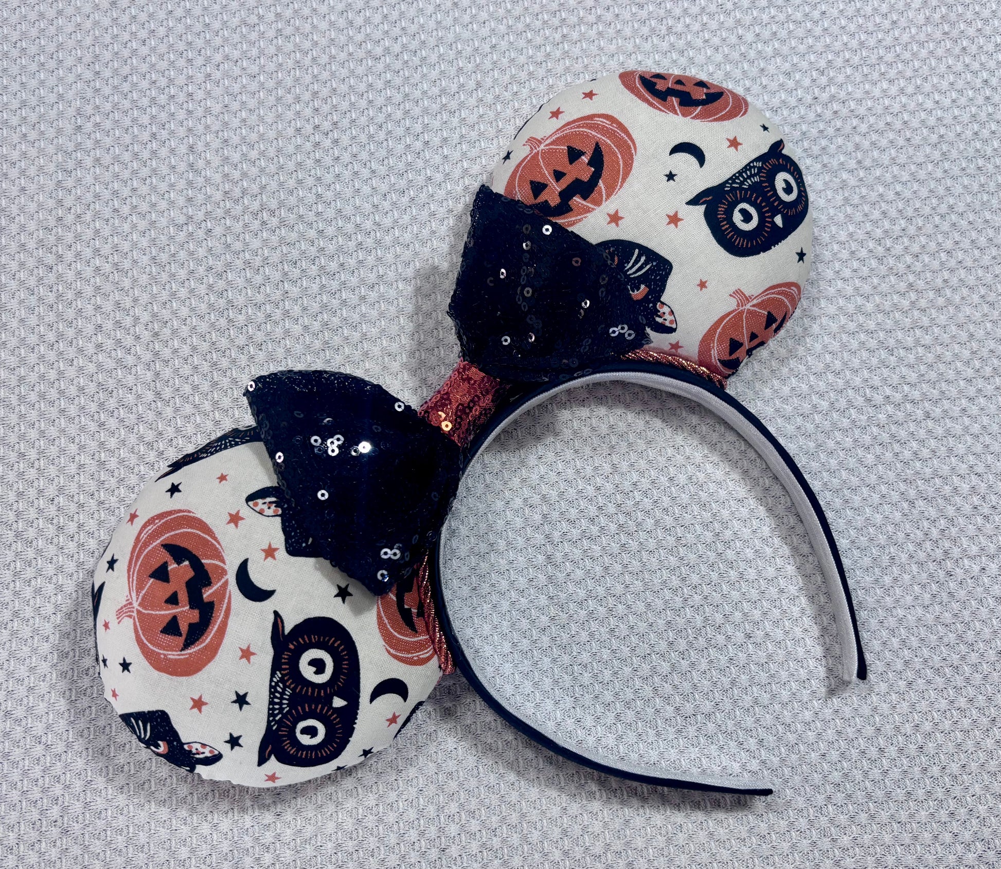 Handmade and ready to ship. Mouse ears with vintage cats, owls, and pumpkin mouse ears are on the front and back of mouse ears with a black sequin with orange middle bow.