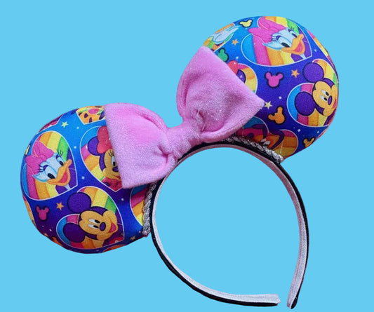 Colorful mouse ears with a pink bow on a white background