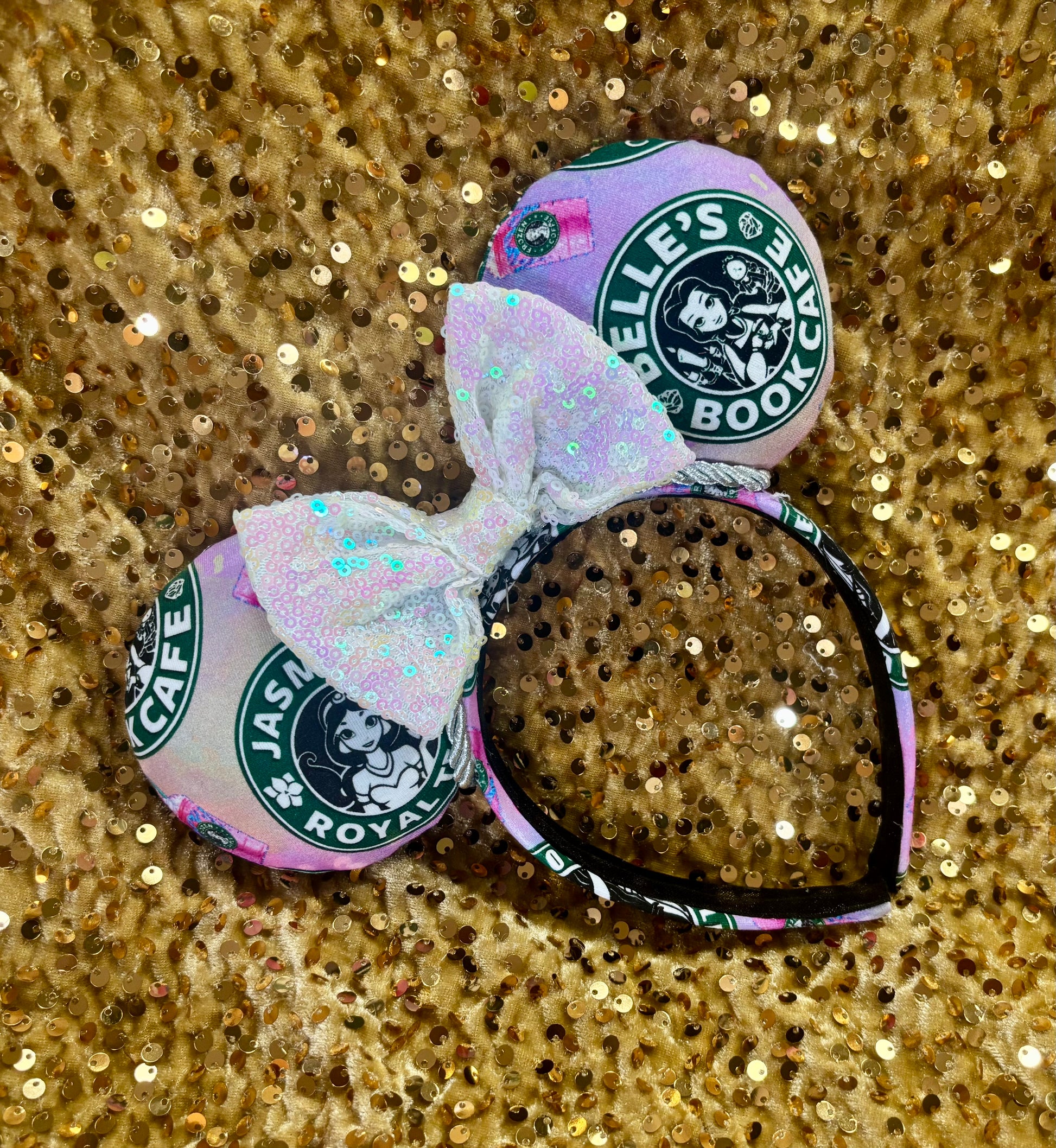 Handmade and ready to ship custom ears with popular coffee themed with princesses on fabric. White iridescent bow and silver twisted trim on a universal sized headband with matching design as the mouse ears.
