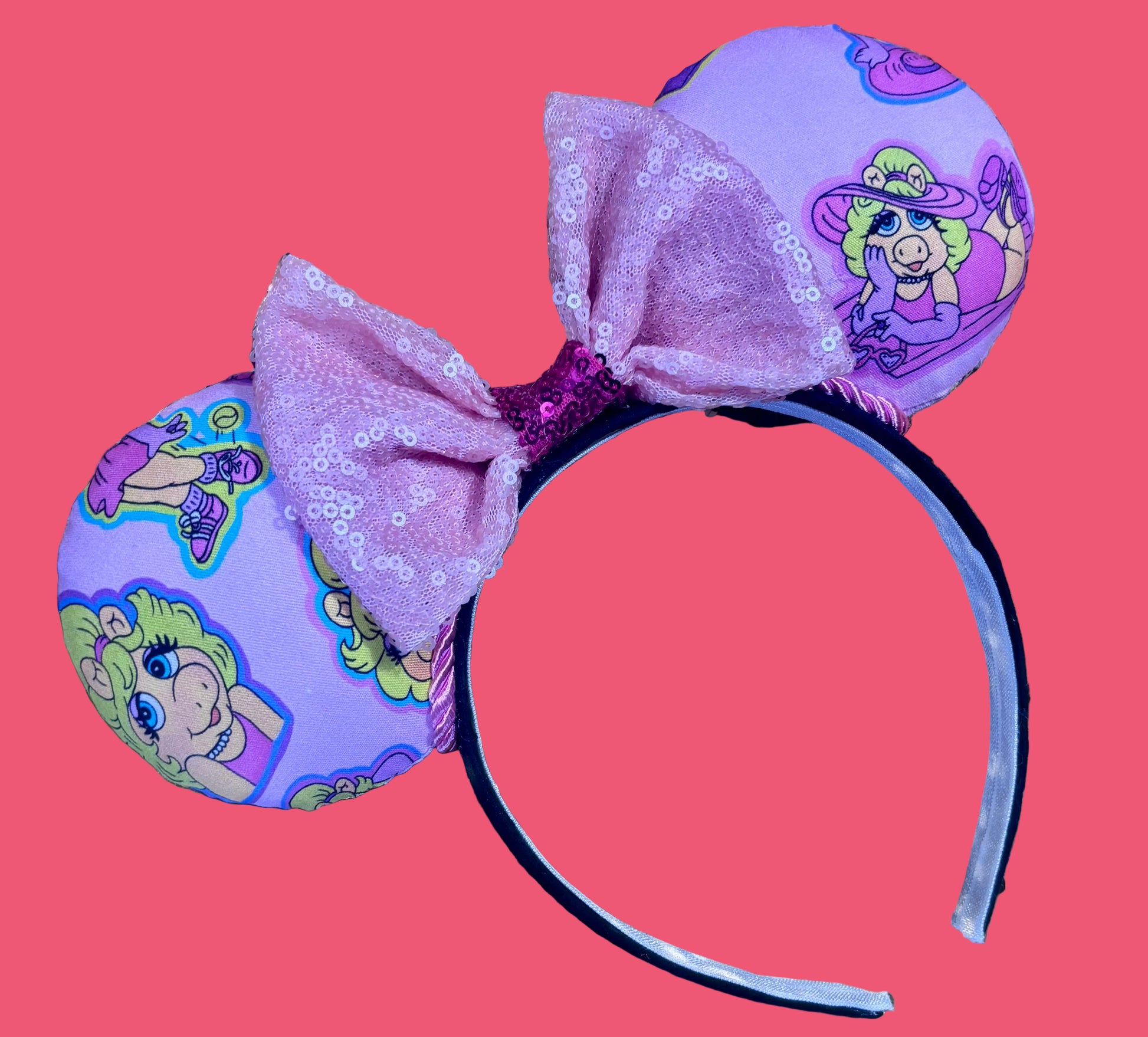 Handmade and ready to ship Piggy mouse ears. Miss Piggy fabric is on the front and the back. On a universal sized black poly fabric headband. 