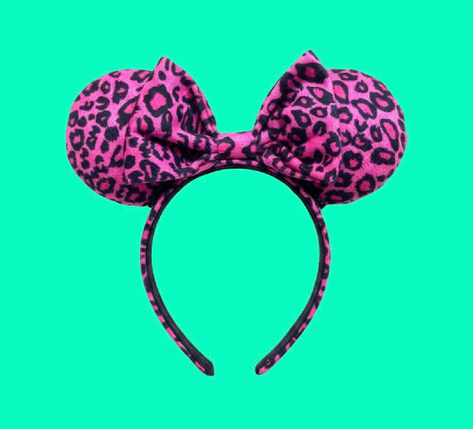 Handmade pink leopard mouse ears. Made and ready to ship. Fabric is on the ears, headband and the bow as well. 