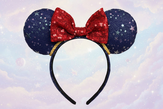 Sorcerer Mickey Inspired Mouse ears are blue and sparkly with a red sequin bow with gold twisted trim. Shown on a light blue background
