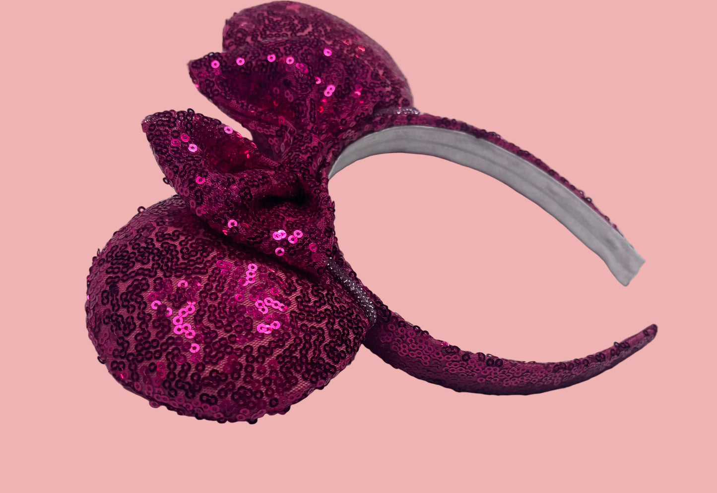 Handmade and ready to ship, Hot Pink Custom Ears. Fabric is on ears front and back with pink rhinestone trim along the inner ears and a matching hot pink sequin bow. The Headband is universal sized and has the same hot pink sequin fabric.