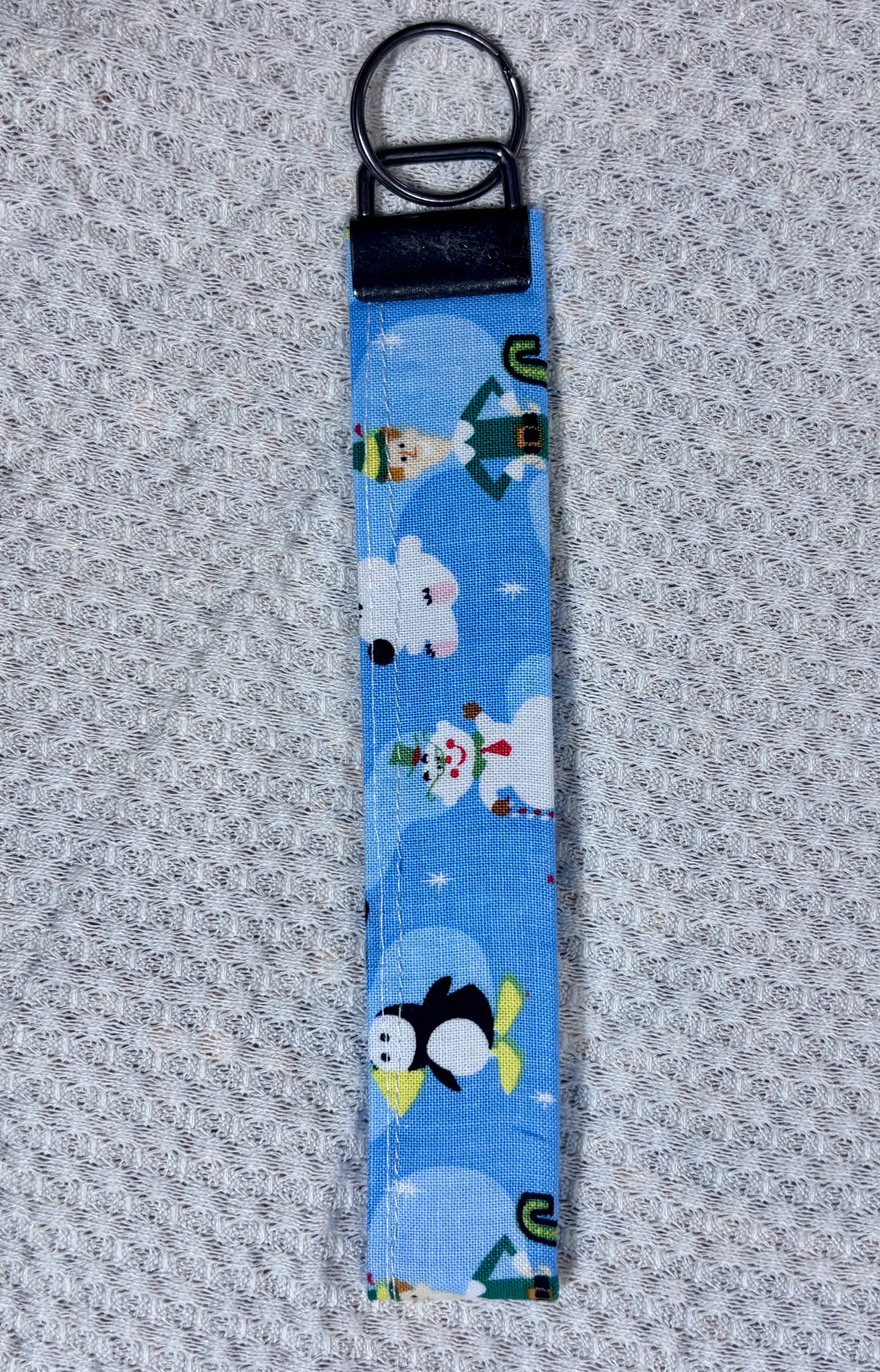 Keychain with cartoon characters on a blue background
