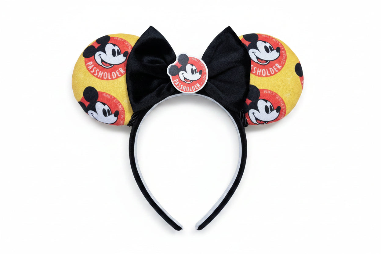 Handmade and ready to ship AP mouse ear headband. The fabric is poly cotton and has the AP logo all over the fabric front and back on a black poly cotton headband with a black velvet bow that has an AP flatback on the middle. 