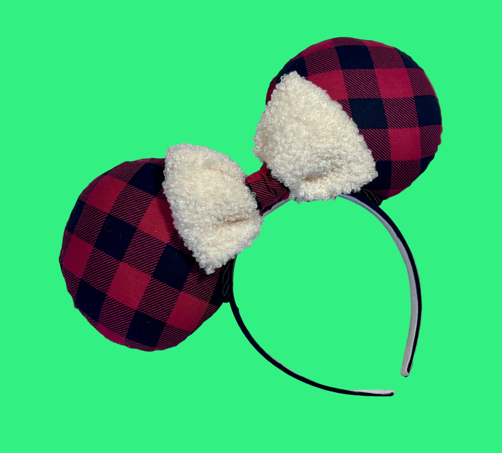 Handmade and ready to ship Buffalo Plaid mouse ears on both the front and back. On a black headband that is universal sized. The set has an off-white soft bow with buffalo plaid middle. Item is shown on a white background.