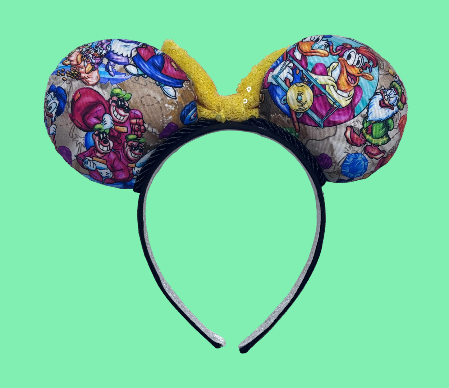 The back side of the mouse ears showing many characters from the classic cartoon along with the twisted trim and headband. Bow is only pinned for pictures. I don't attach the bow until the order is placed in case the customer want a different color bow. 