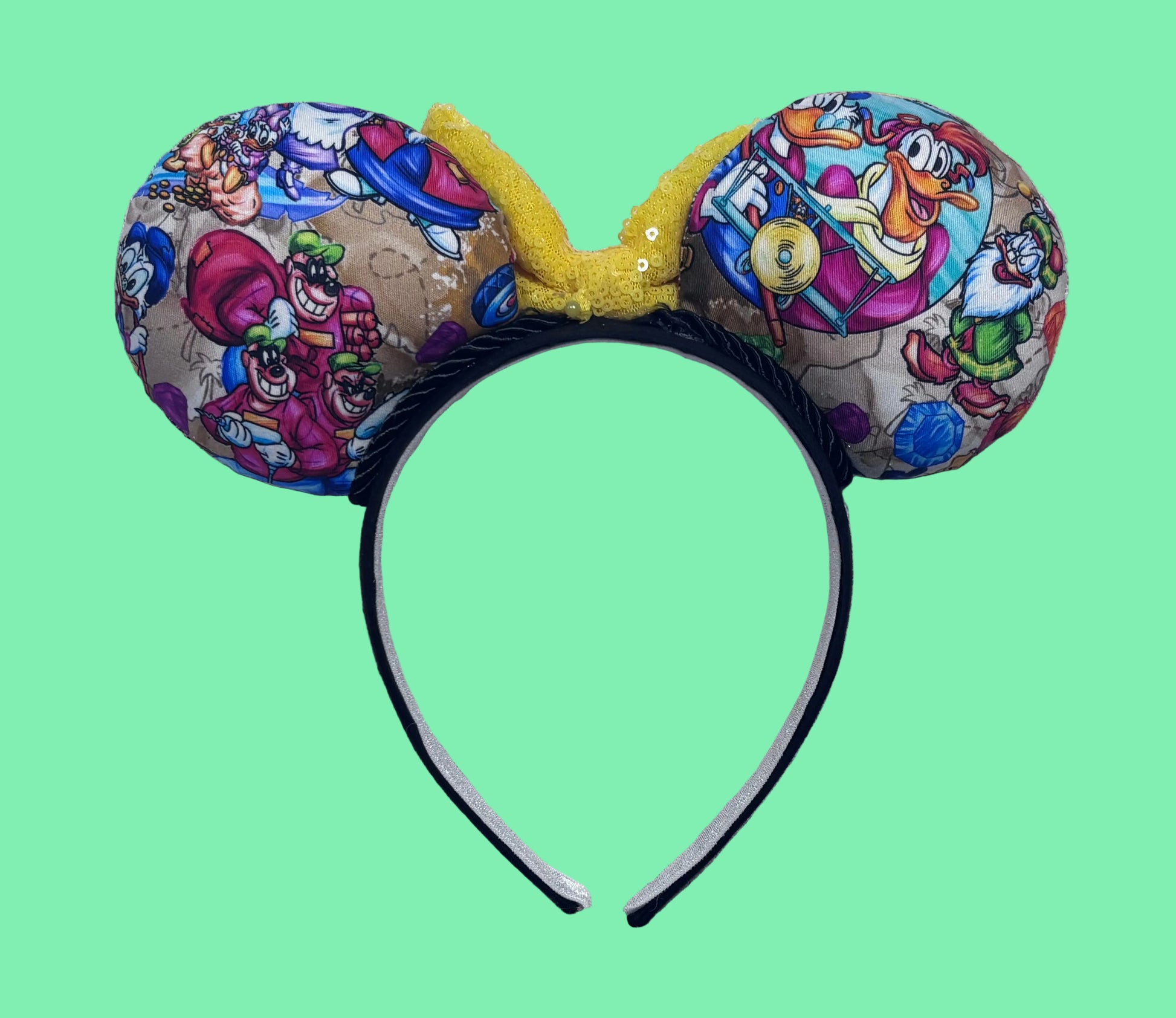 The back side of the mouse ears showing many characters from the classic cartoon along with the twisted trim and headband. Bow is only pinned for pictures. I don't attach the bow until the order is placed in case the customer want a different color bow. 