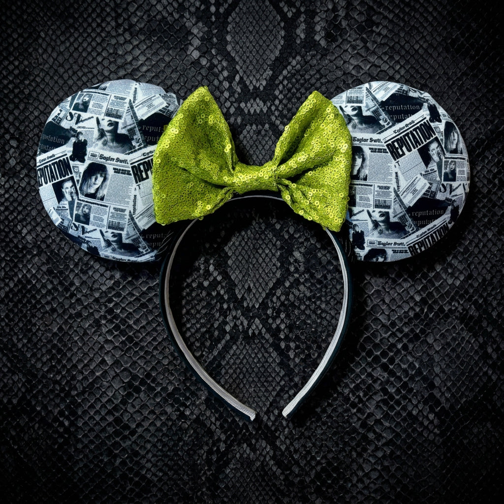 Handmade ear headband with TS inspired newspaper images on the front. Lime green sequin bow. 