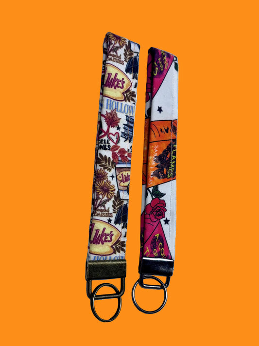 Two keychains with colorful designs. 