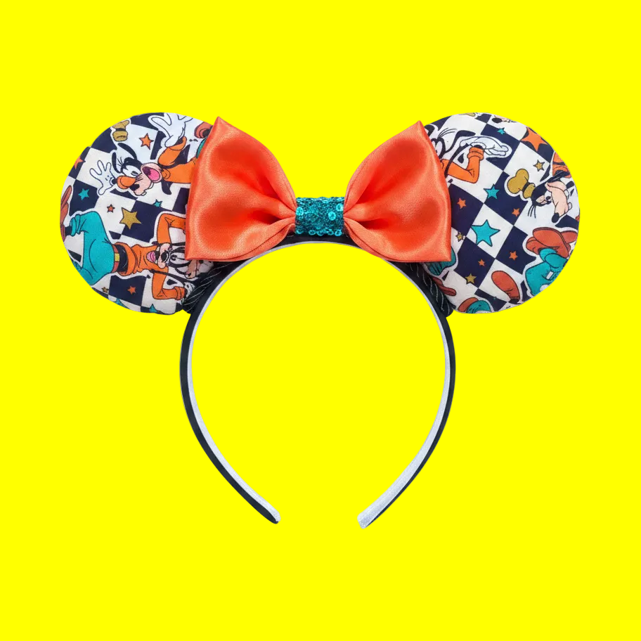 Handmade and ready to ship, Pretty Goofy Custom Ears. Fabric is on ears front and back with a black twisted trim and orange stain bow with a turquoise green middle to match Goofy's clothing. Headband is universal size with black poly cotton fabric and elastic lining.