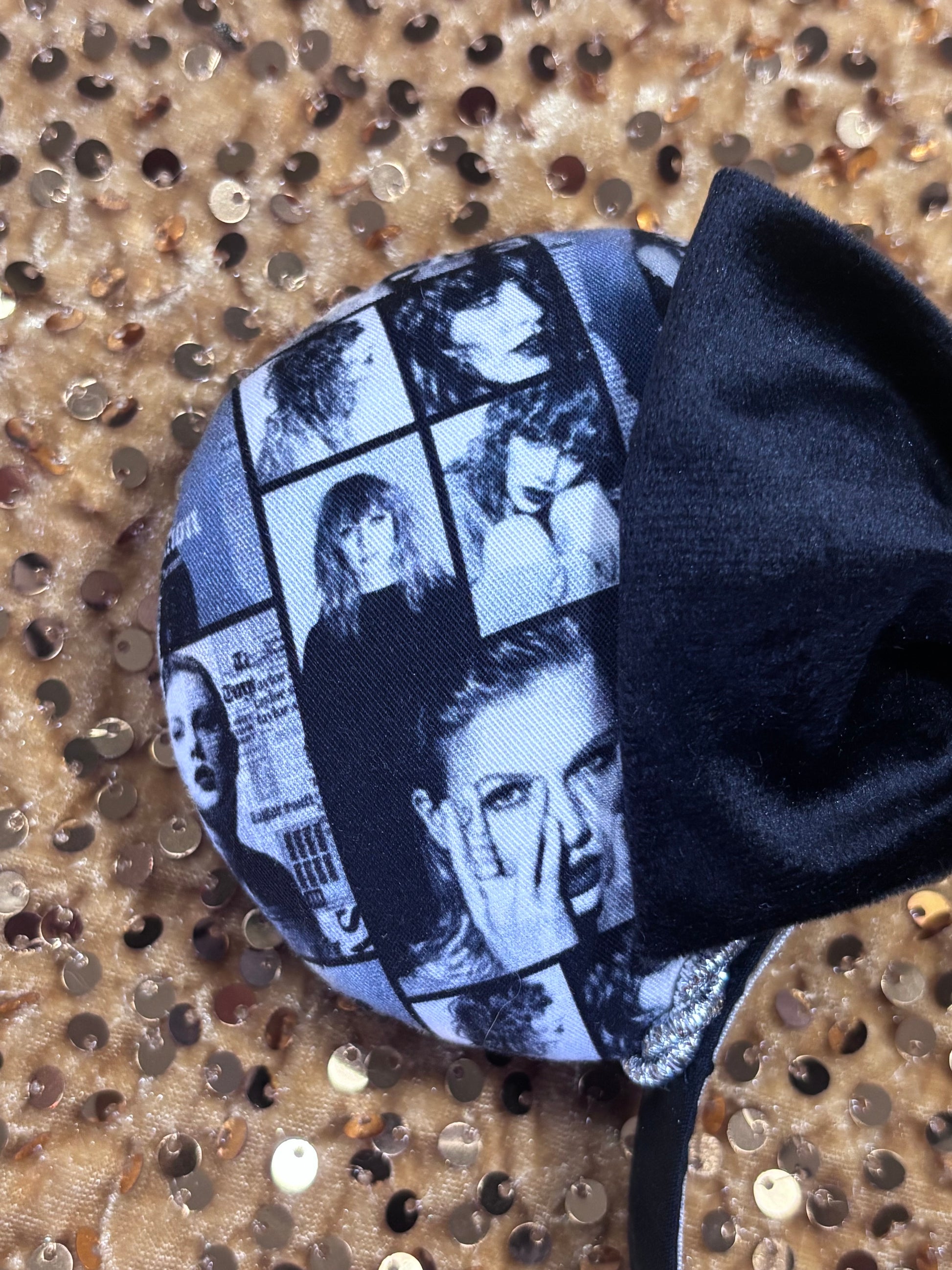 close up of front mouse ear. Handmade and ready to ship "BAD' reputation Mouse ears with a new beautiful black velvet bow. Of course, you can still request any bow in sequin if you prefer and I will attach it. Shown on a gold sequin background.