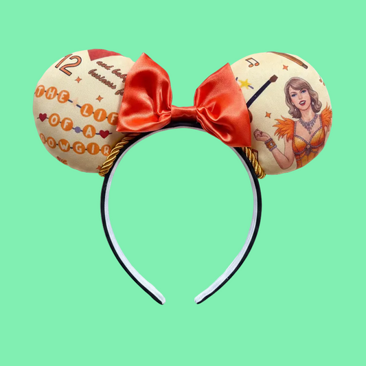 Handmade and ready to ship Ophelia Mouse ears with TS images on the ears along with TLOAS with an orange satin bow, orange twisted trim and on a black universal sized headband. 