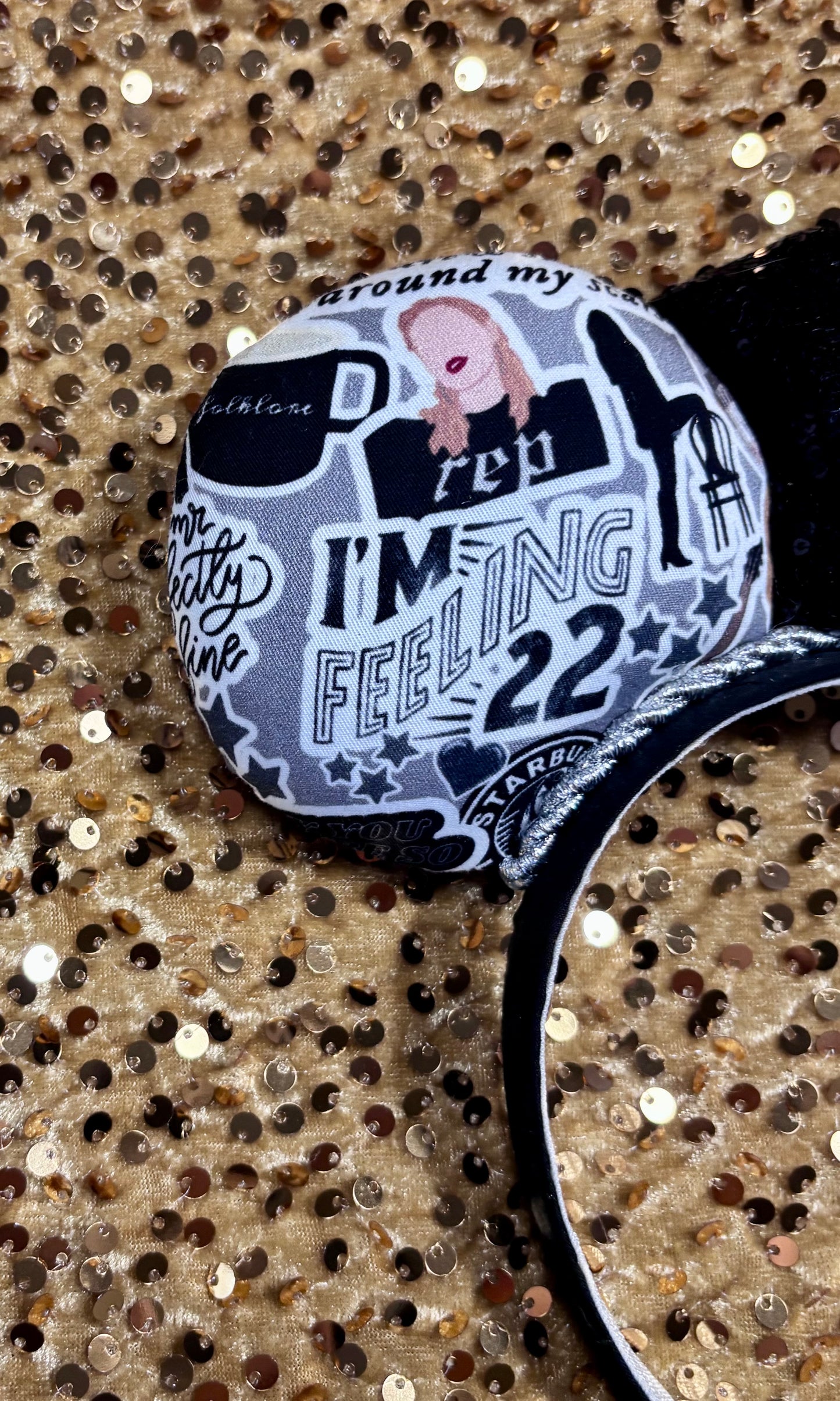 Handmade and ready to ship Mouse Ears with Black and White Swiftie sayings and pictures. has a black sequin bow.