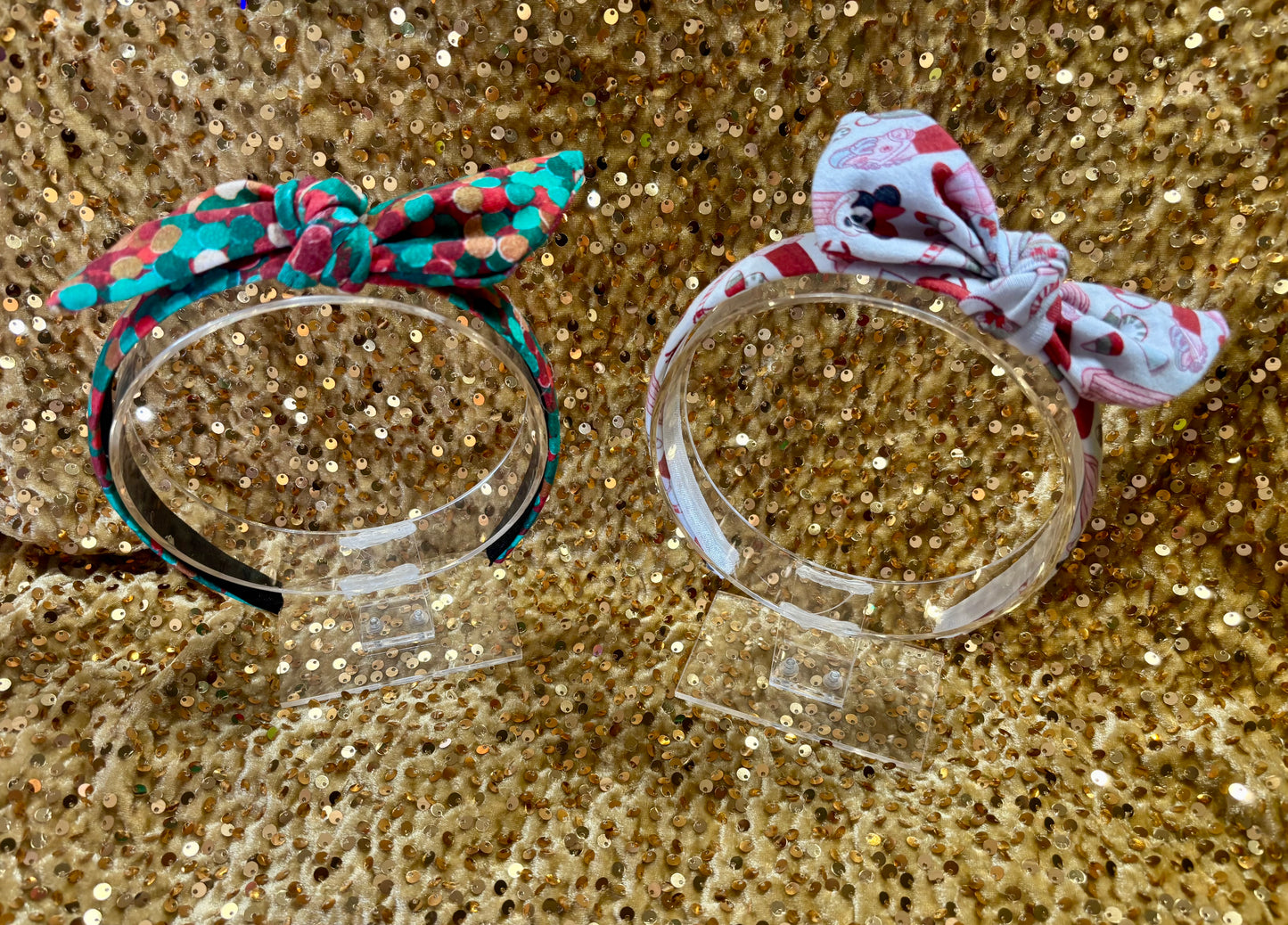 Two Handmade and ready to ship twisted bow headbands with designs in Christmas dots and Stocking Stuffers. Fabric is a soft and stretchy cotton Lycra fabric on universal sized headbands. 