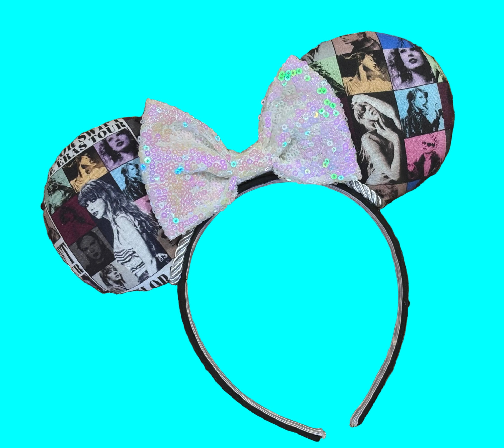 Eras Mashup Mouse Ear headband with white iridescent sequin bow. You can request any color sequin bow in your order by leaving a note. Handmade and ready to ship with fabric on both the front and the back of mouse ears. The set has a silver twisted trim along the inner ears. Ears are on a black poly cotton universal sized headband.