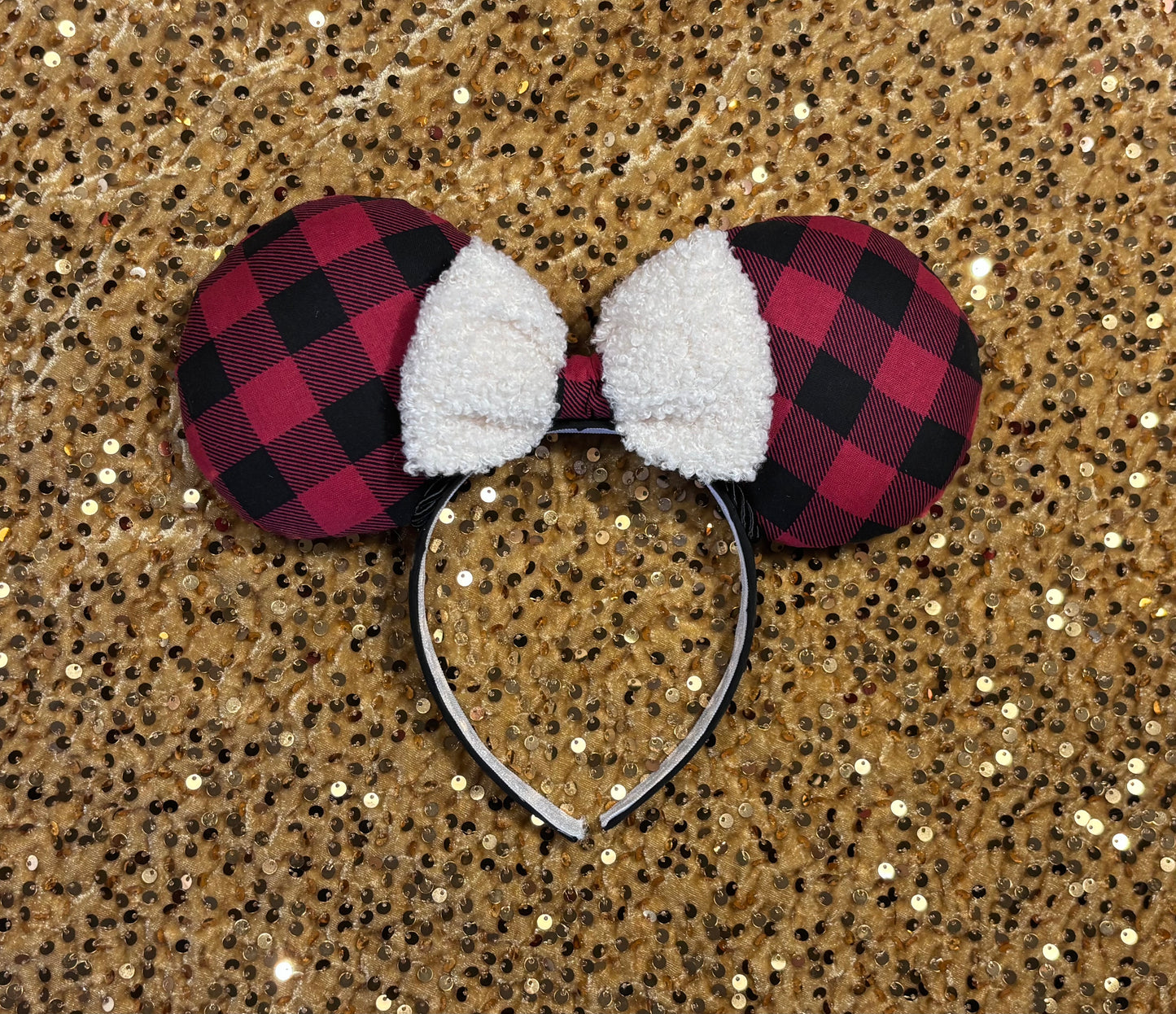 Buffalo Plaid mouse ears on a glittery gold background