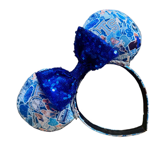 No Other Shade of Blue handmade mouse ears on a black universal headband with a blue sequin bow, shown on a white background.
