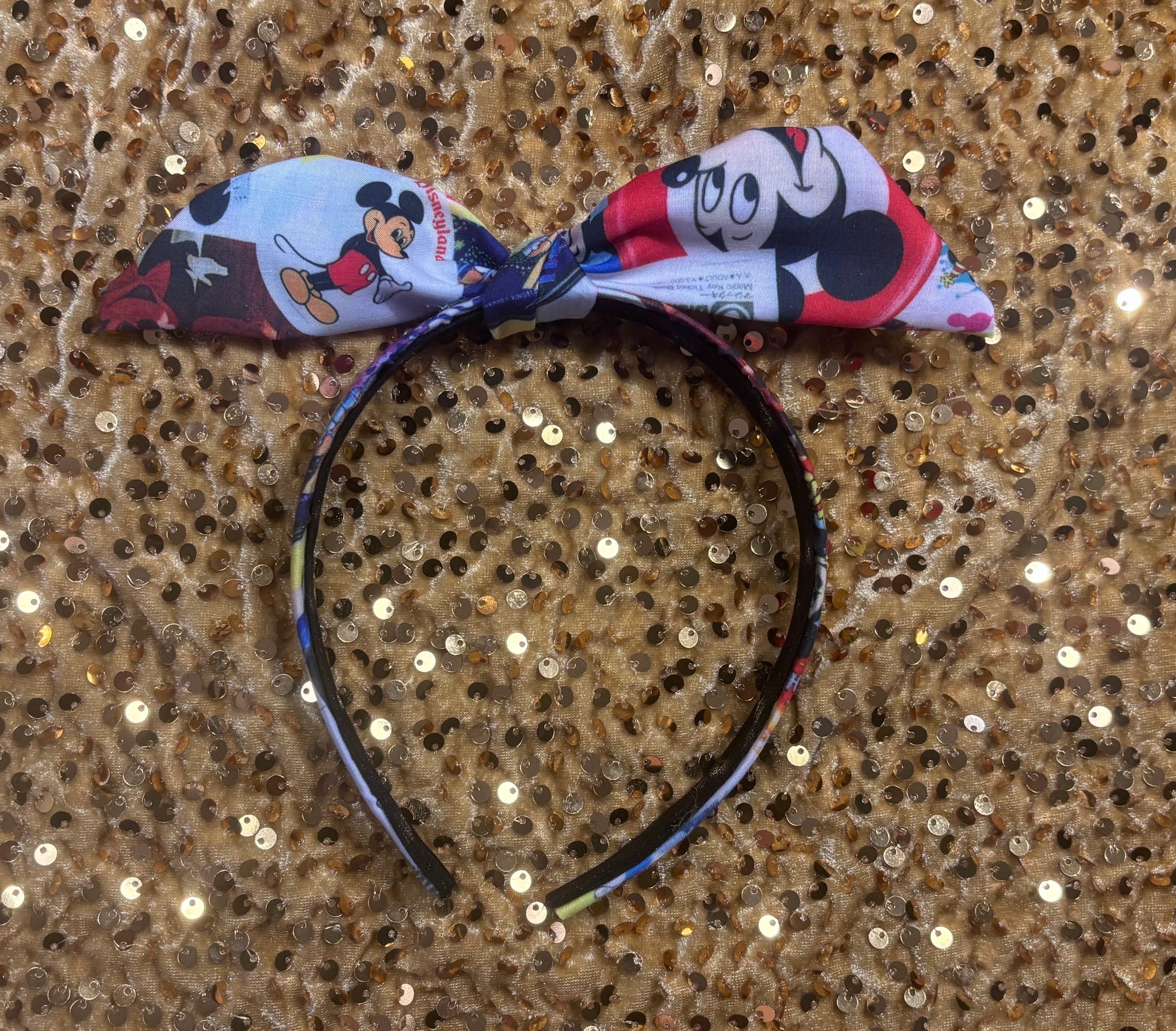 Park themed twisted headband showing views of Mickey and friends.