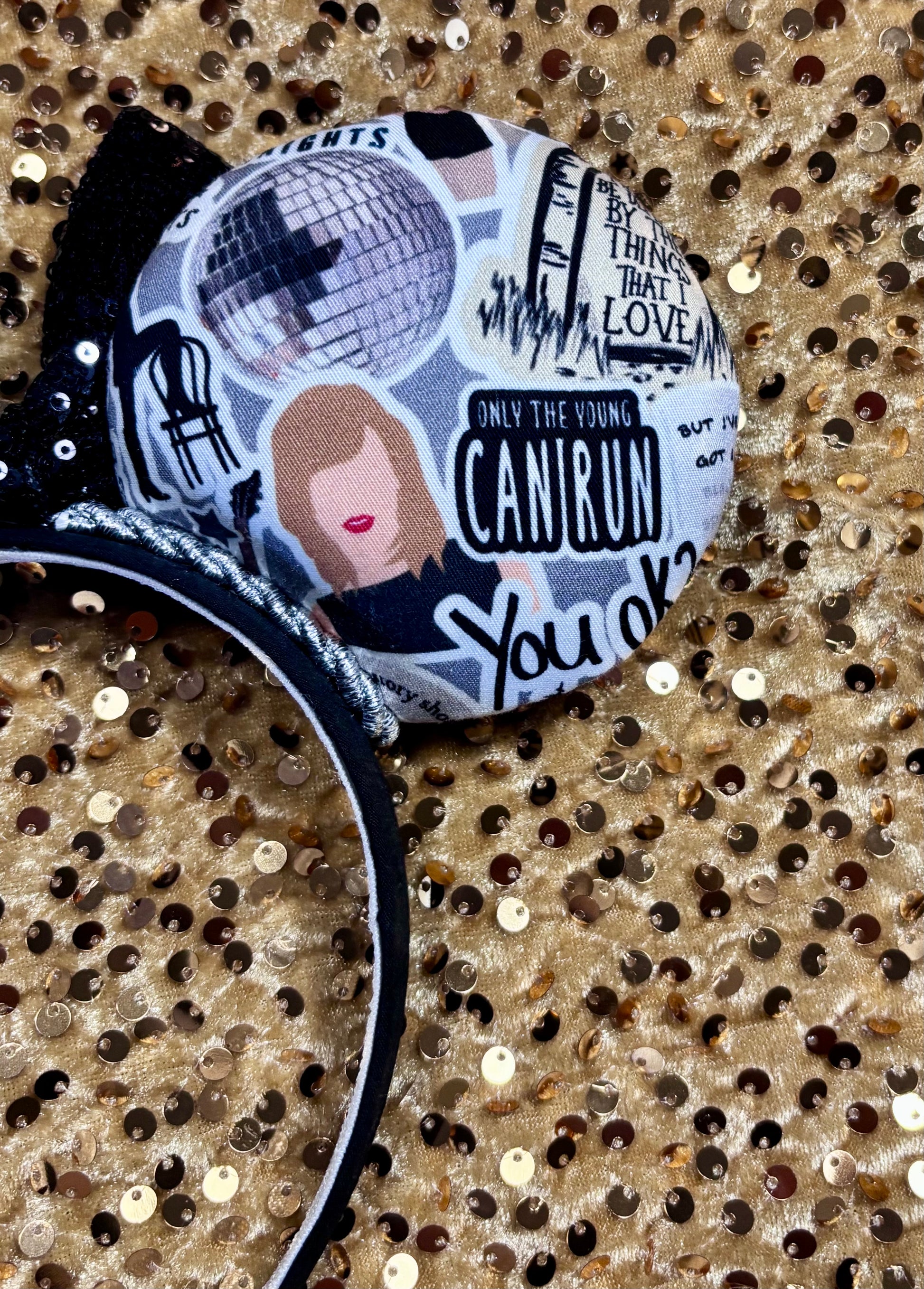 Handmade and ready to ship Mouse Ears with Black and White Swiftie sayings and pictures. has a black sequin bow.