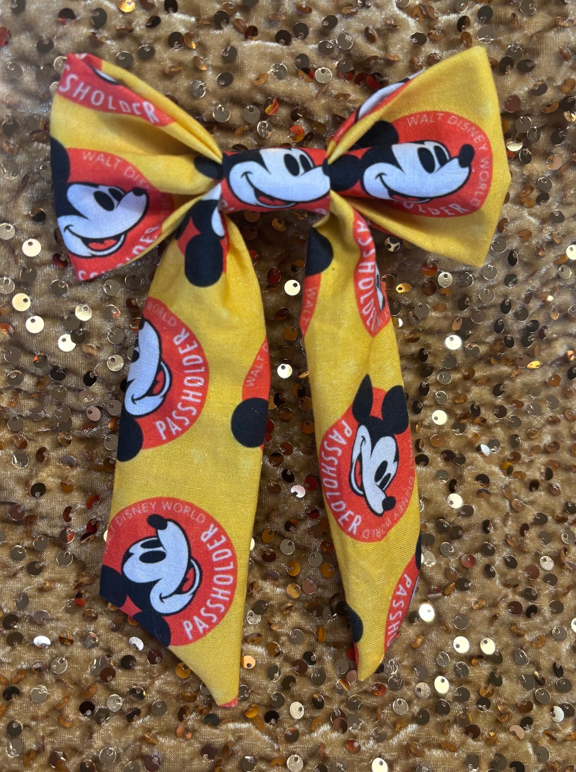 Yellow bow with AP design on a glittery background. Handmade and ready to ship. 