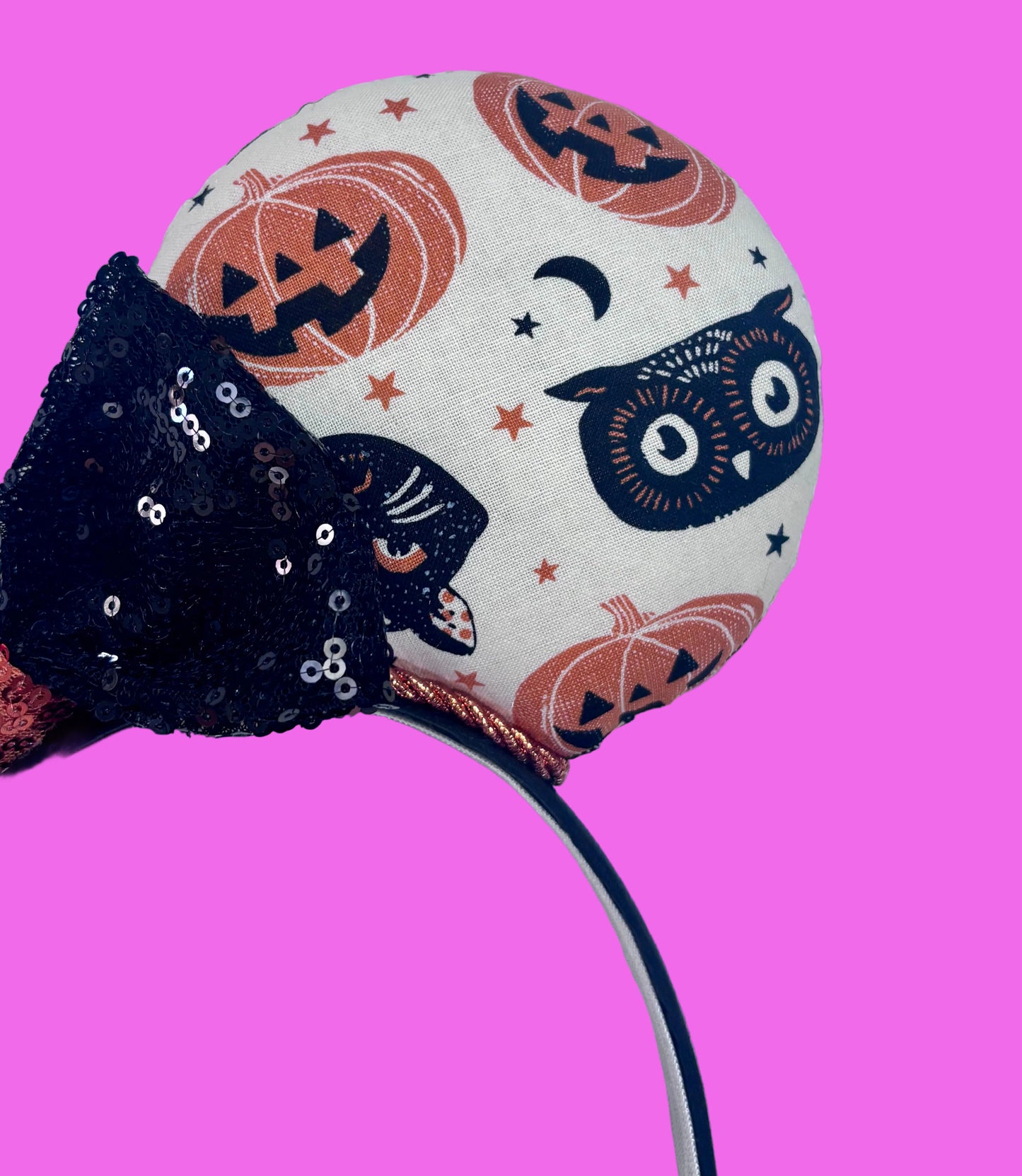 Close up of front mouse ear. Handmade and ready to ship. Halloween Mouse ears with vintage cats, owls, and pumpkin mouse ears are on the front and back of mouse ears with a black sequin with orange middle bow.