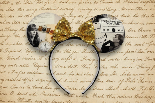 Mouse ear Headband with gold sequin bow inspired by TTPD. Shown on a textured background