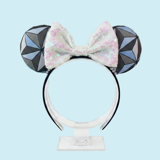 Handmade and ready to ship Mouse ear headband with a geometric design inspired by Spaceship Earth ride and a white iridescent bow on a universal sized black headband.