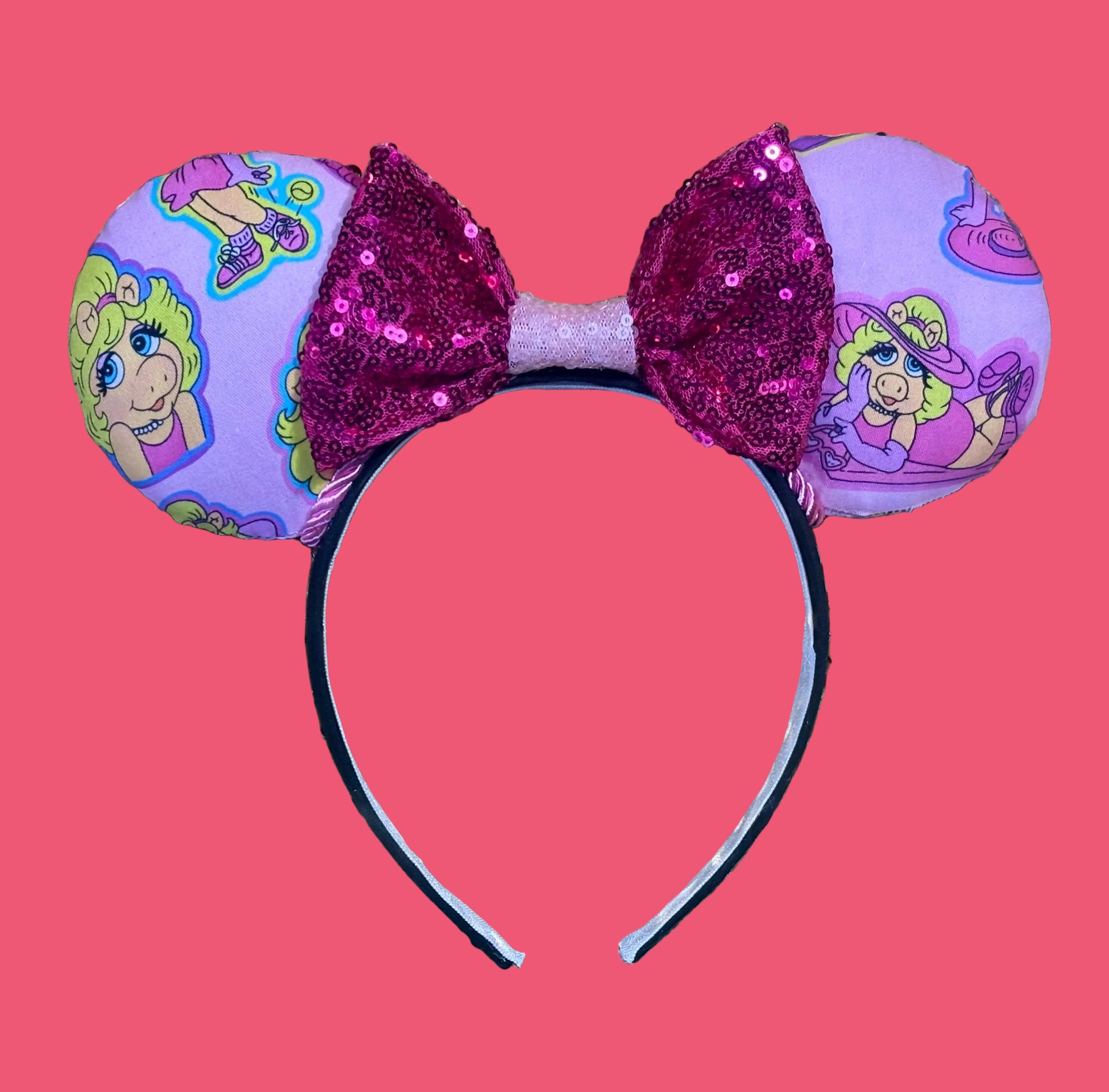 Handmade and ready to ship Piggy mouse ears. Miss Piggy fabric is on the front and the back. On a universal sized black poly fabric headband. 