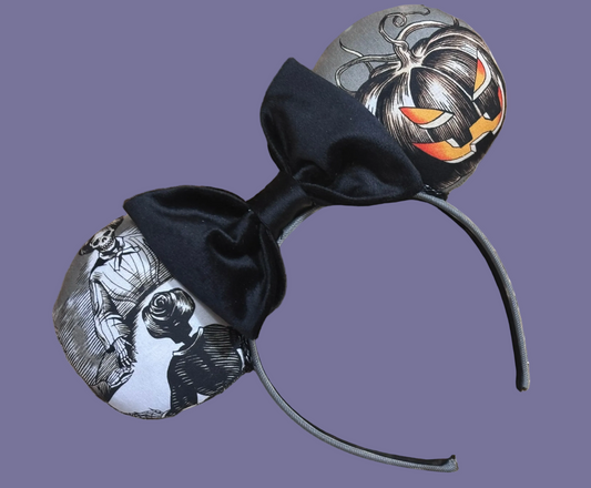 Handmade and one of a kind Halloween mouse ears with the fabric on both the front and back. Skeleton ghost having a seance on one side and an evil pumpkin on the other ear. The headband is grey and universal sized and fits most. The set has a black velvet bow. 