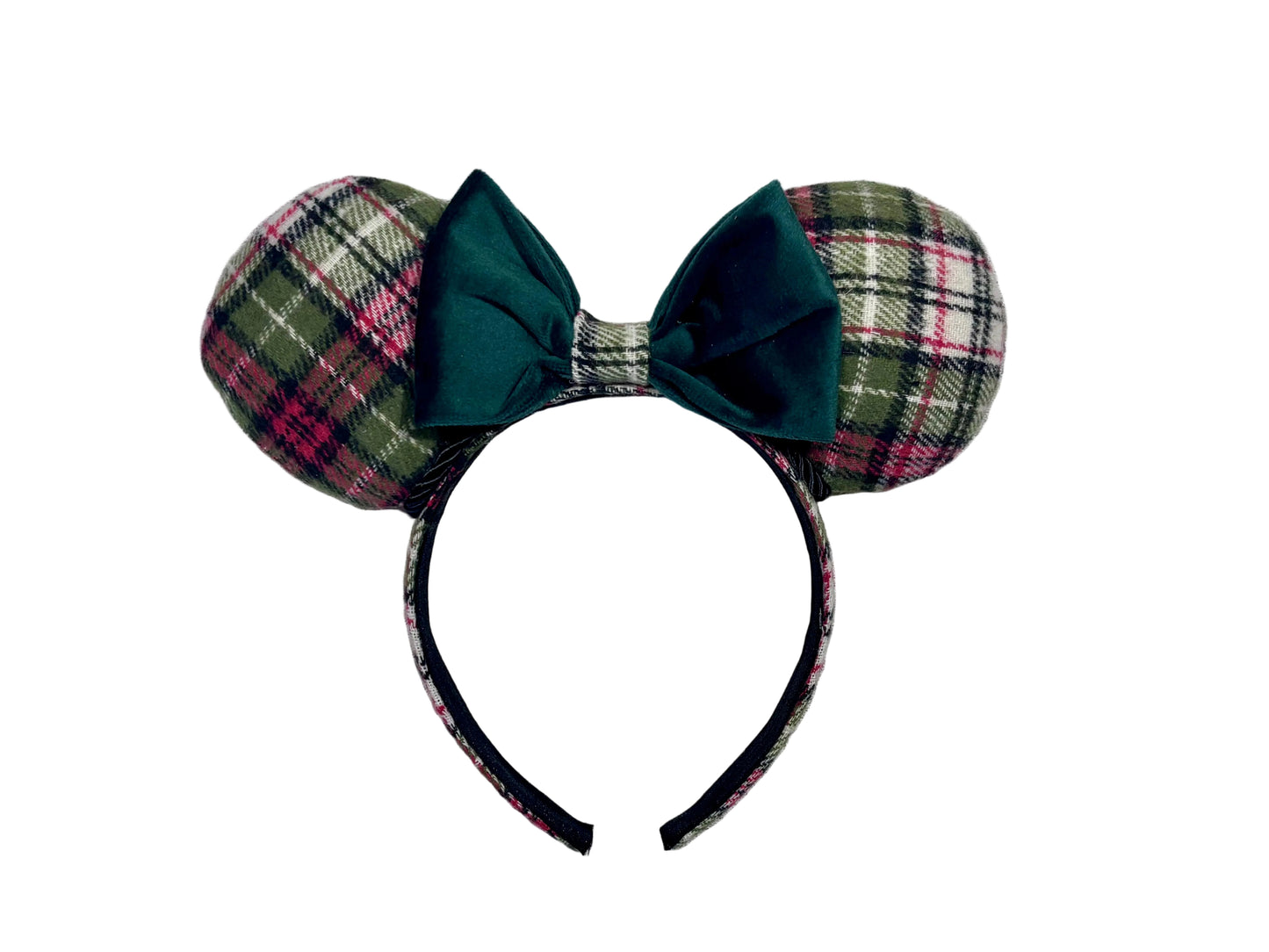 Plaid mouse ears with a green bow on a textured gray background