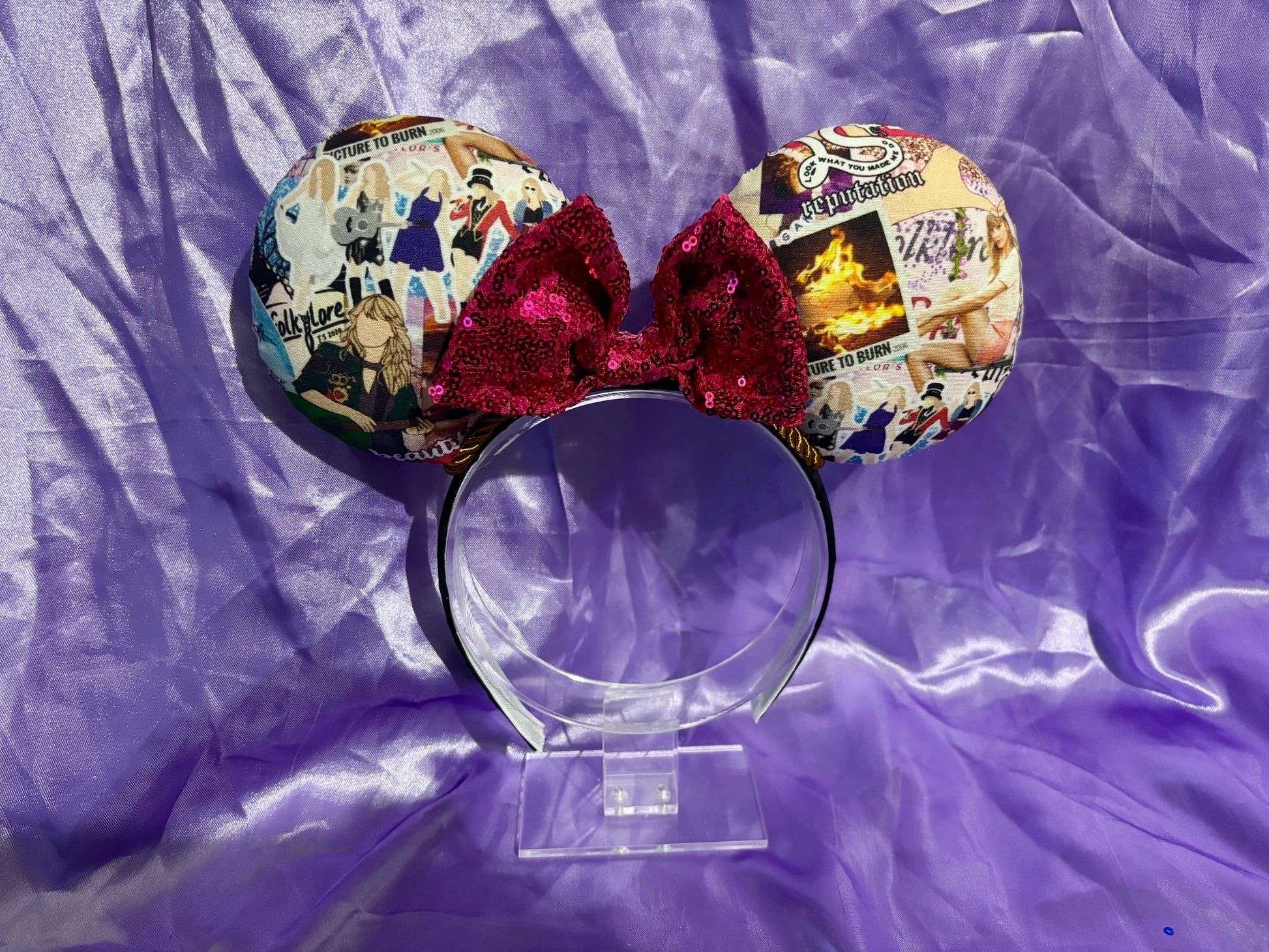 Mouse ears with colorful design on a purple fabric background