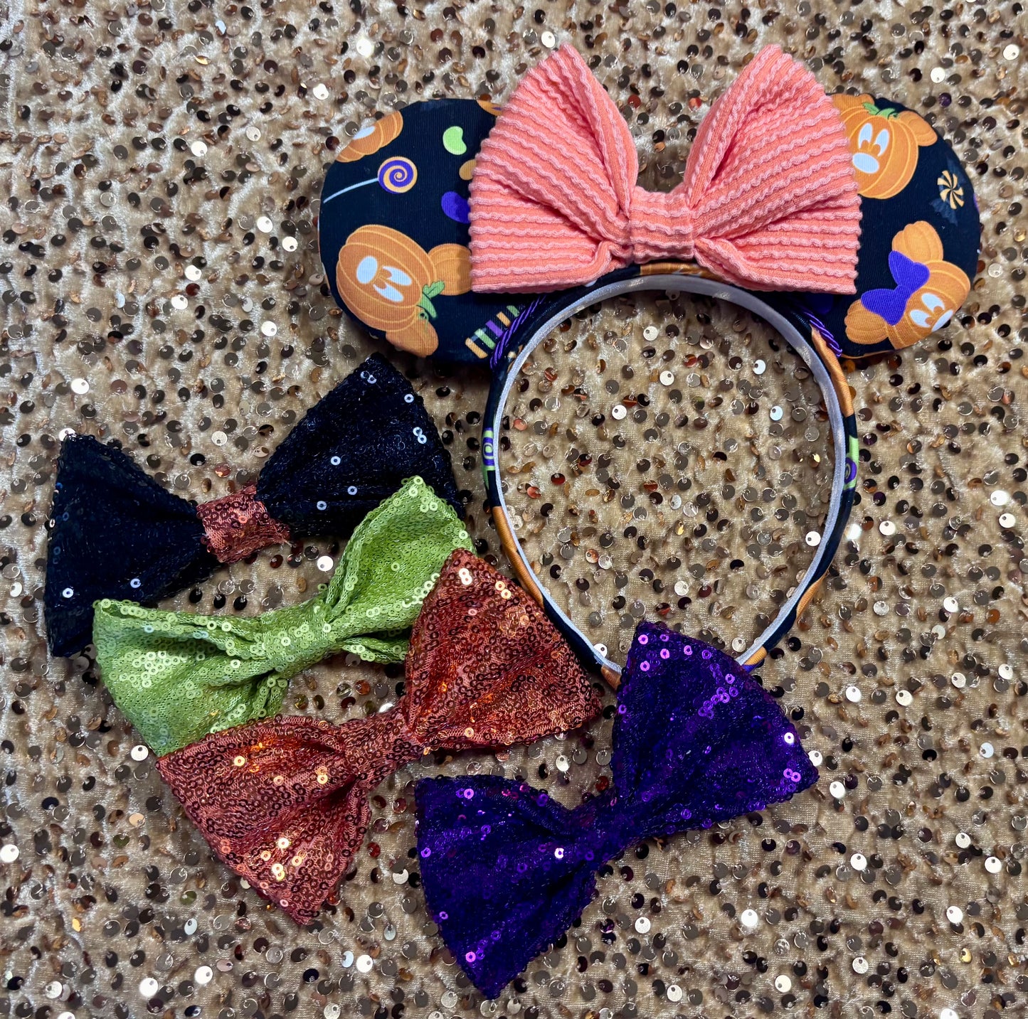 handmade mouse ears with halloween boo to you fabric on ears and the headband.  Orange waffle print bow with other sequin bows if you prefer a different one than the orange waffle