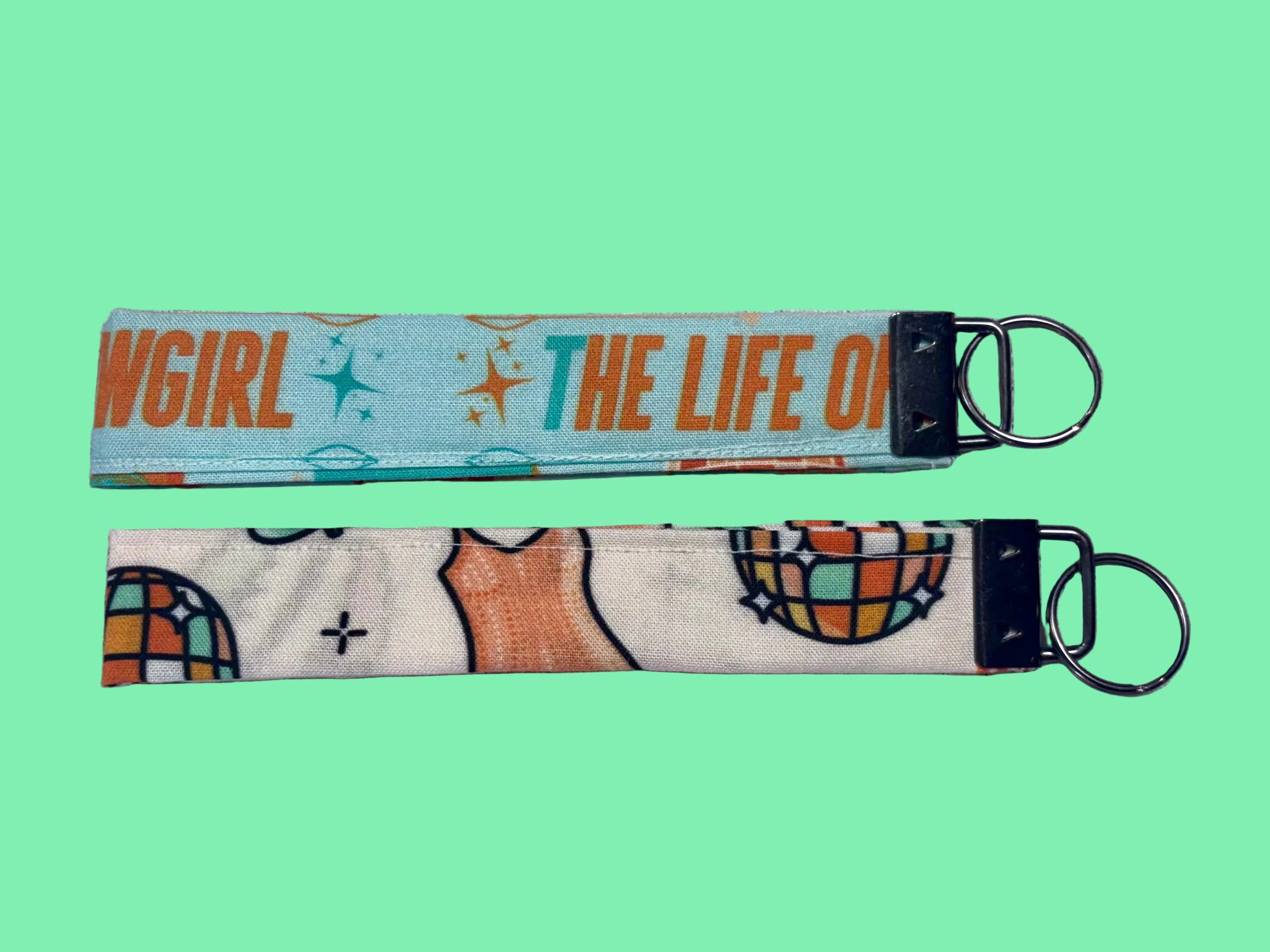 Two keychains from the back view. Showgirl inspired and handmade and ready to ship. 
